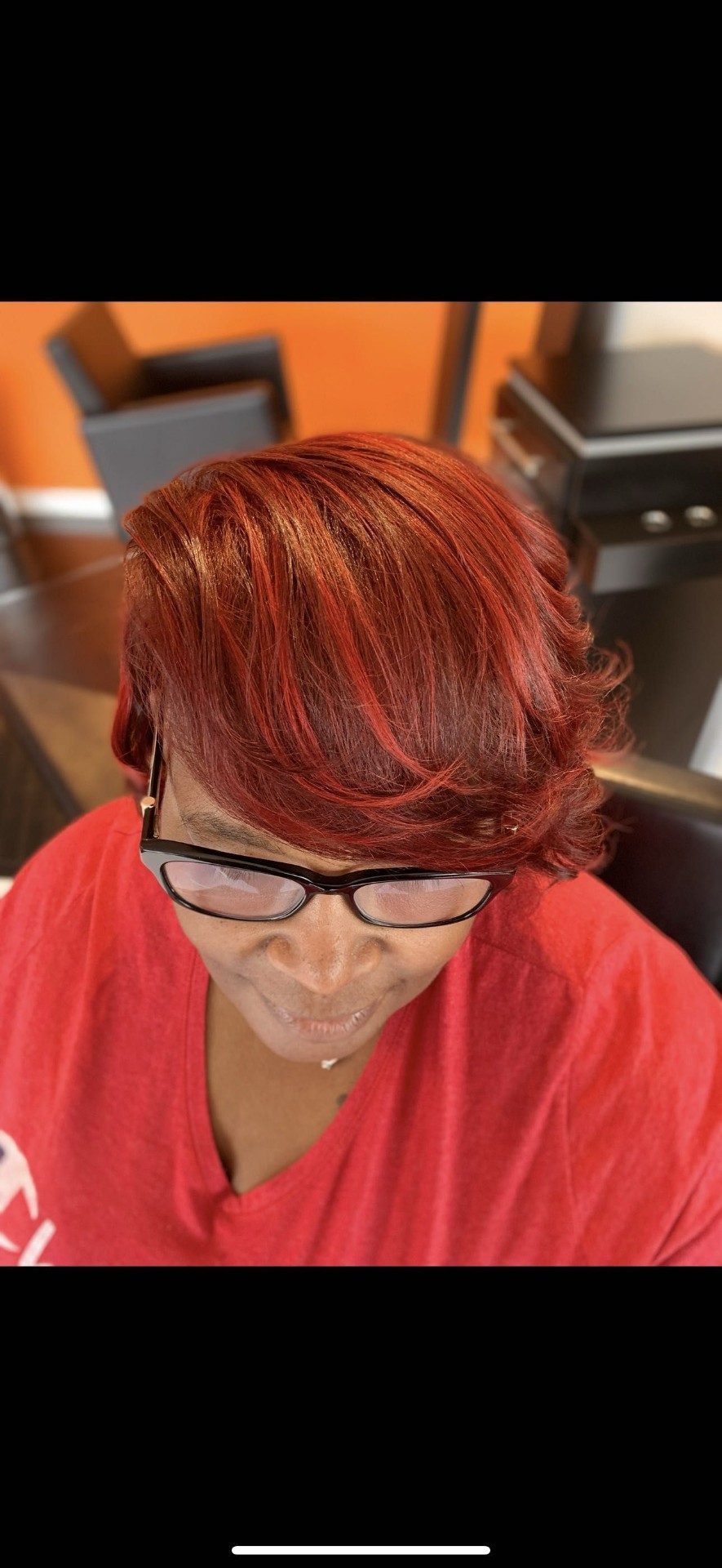 Vibrant red color pixie style with feathered layers Frisco